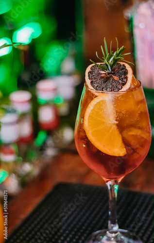 A special amazing drink served with oranges. dried fruit and rosemary at Villa Europa Pub, a Brazilian bar with European details.
