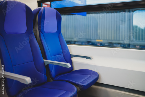 Blue seats in a modern electric train.