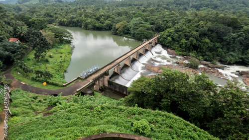dam in the mountains , bridge and dam over the river from Kerala, India