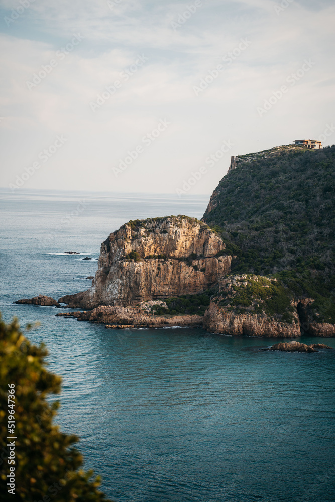 Cliffs & rocks of tropical coast by the ocean