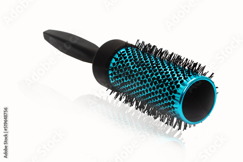 Blue hair comb brush with handle isolated on white.