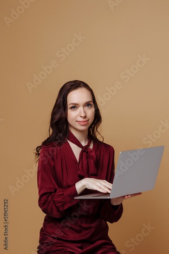 Girl standing with laptop
