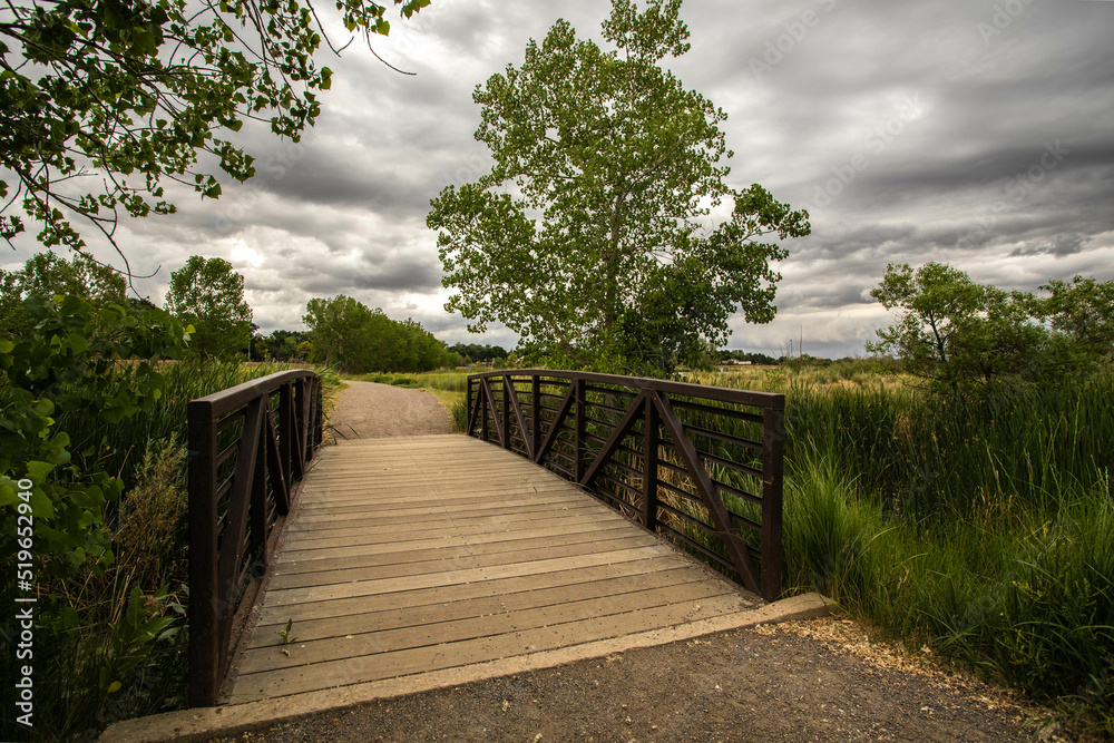 Bridge on a trail during a cloudy, stormy day