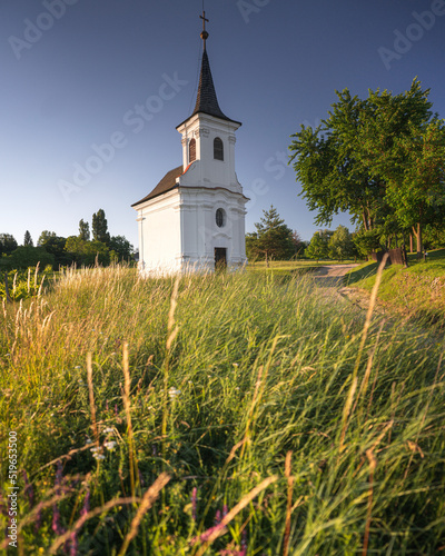 Nice old white chapel with flowers at Balatonlelle