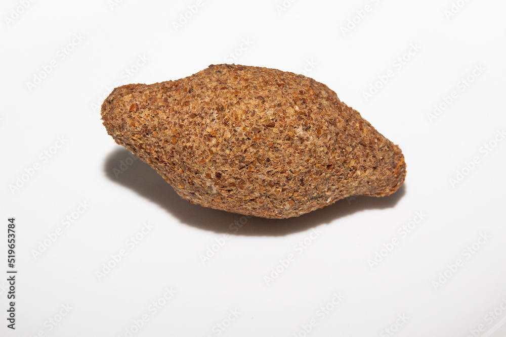 Traditional Syrian kibbeh isolated on white background in selective focus. Arabic kibe (quibe) Traditional Syrian kibbeh isolated on white background in selective focus. Arabic kibe (quibe)
