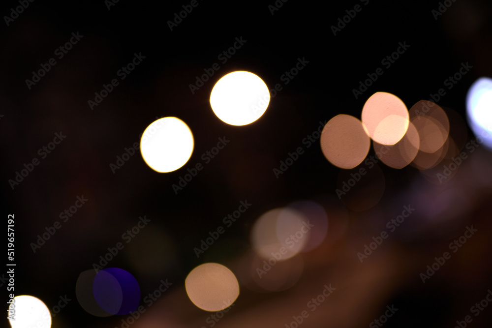 orange bokeh light circles on black background orange bokeh light circles on black background