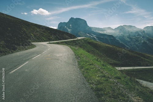 Road uphill to the mountain Col d'Aubisque in the pyrenees in south france in the sunset. photo