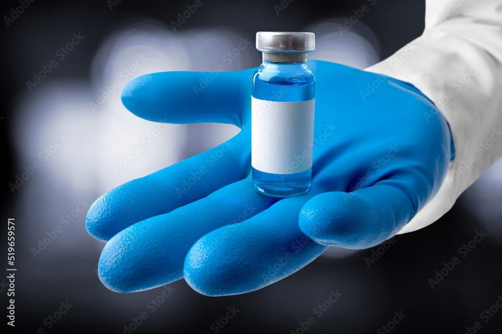 A vial of vaccine for Monkeypox virus, on outdoor background - obrazy, fototapety, plakaty 