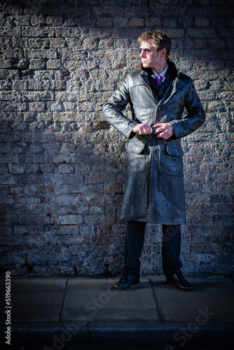 Undercover; covert operations. A spy attempting to hide in the shadows; from a series of images with the same character.