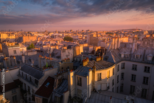 Parisian roofs of Montparnasse and Montmartre at sunset Paris, France