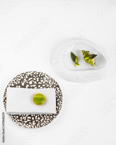 peas on a plate molecular cuisine  unusual white background concept. exquisite delicacies