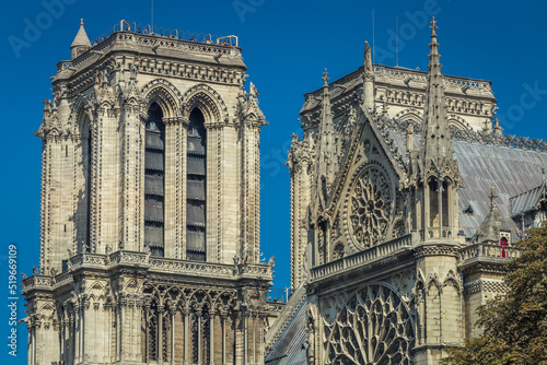 Notre Dame of Paris towers, columns and archs, side view, France