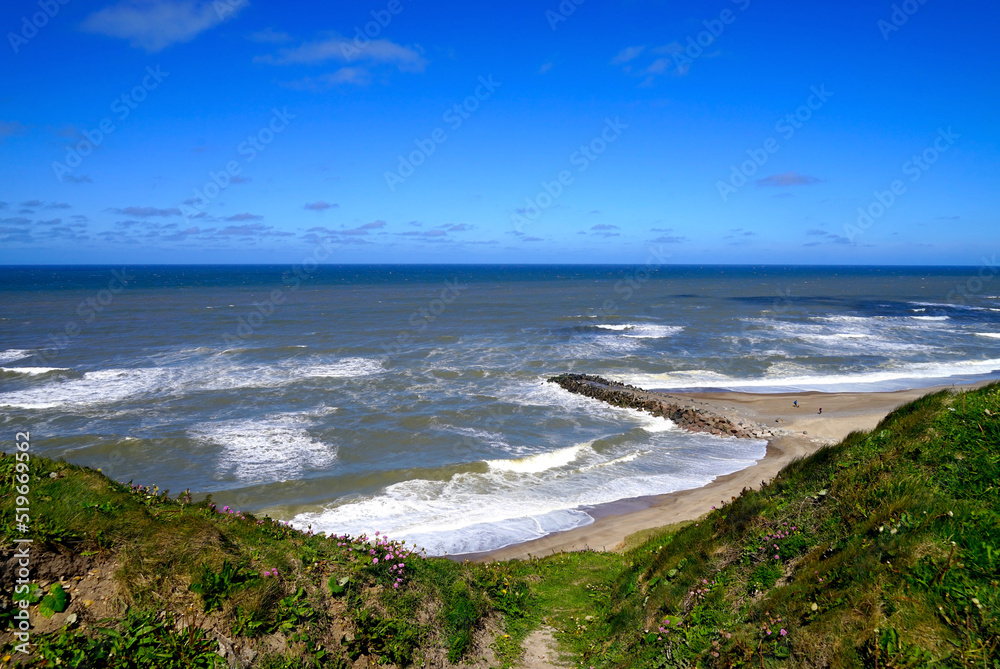 View from the cliffs at the well-known Bovbjerg Fyr Lighthouse near Ferring in Denmark towards the beach and the Norse Sea, Jutland, Denmark