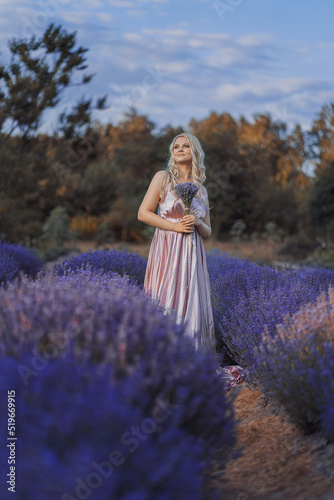Beautiful girl on the lavender field. Fashion and Style.  French provence. Summer photo session.
