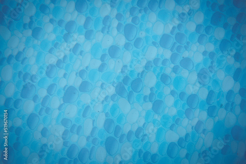 swimming pool background texture under blue water, Texture of water surface and bubbles bottom. Overhead view. Summer background. Copy space