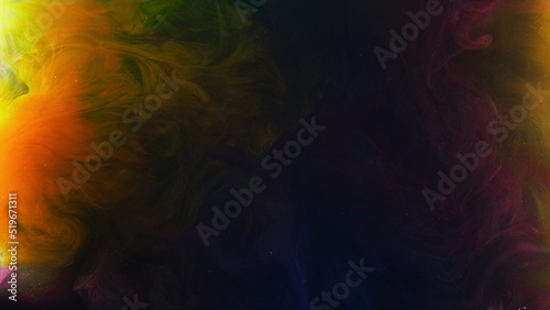 Colorful rainbow paints being squeezed into water on black background. Stock footage. Colored clouds moving slowly underwater and mixing.