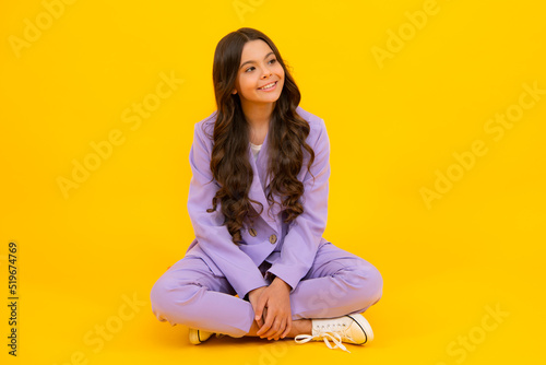 Full length of her she attractive pretty lovely cute cheerful cheery teenager child girl isolated over vivid yellow background. Mock up copy space.