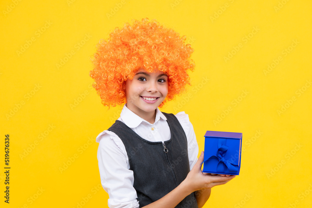 Child with gift present box on isolated background. Presents for birthday, Valentines day, New Year or Christmas. Happy girl face, positive and smiling emotions. Child with gift present box on isolated background. Presents for birthday, Valentines day, New Year or Christmas. Happy girl face, positive and smiling emotions.