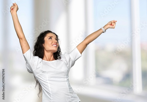 Happy young woman stretching with a smile