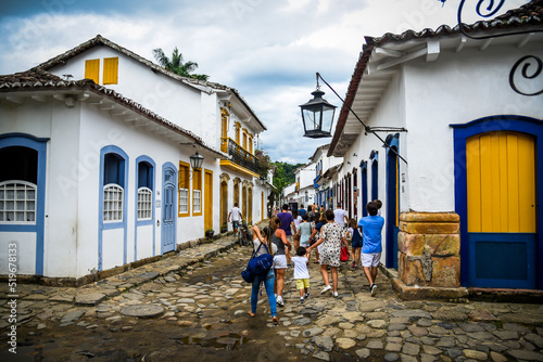 People walking in the street of the historic town of Paraty, State of Rio de Janeiro, Brazil. Photo taken with a Nikon D750 24-120 lens, at 28mm, 1/1000 f 4.0,  ISO 200. Date: Jan 03, 2018. photo