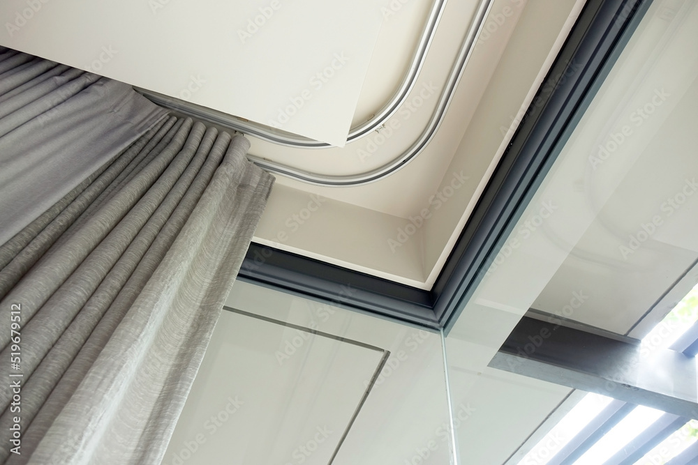 Curtain rails in bedroom corner. Double curtain rails and ceiling board ...