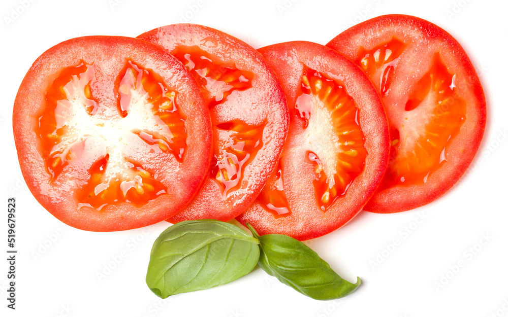 Slices of tomato and basil leaves isolated over white background. Top view, flat lay.. Slices of tomato and basil leaves isolated over white background. Top view, flat lay..