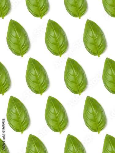 Sweet Basil herb leaves isolated over white background closeup. Flat lay, top view. Seamless pattern.. © Natika