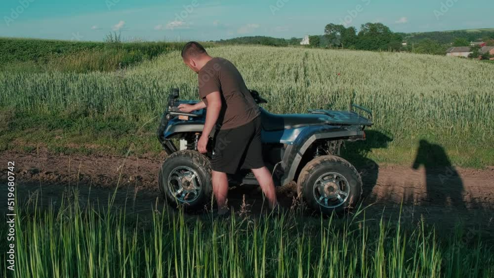 The guy near the ATV, feeding before the trip, care. The guy near the ATV, feeding before the trip, care.