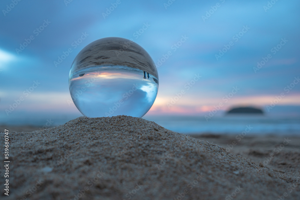 amazing view of the sea and sky in beautiful sunset are unconventional and beautiful inside crystal ball. .A image for a unique and creative travel. amazing view of the sea and sky in beautiful sunset are unconventional and beautiful inside crystal ball. .A image for a unique and creative travel.