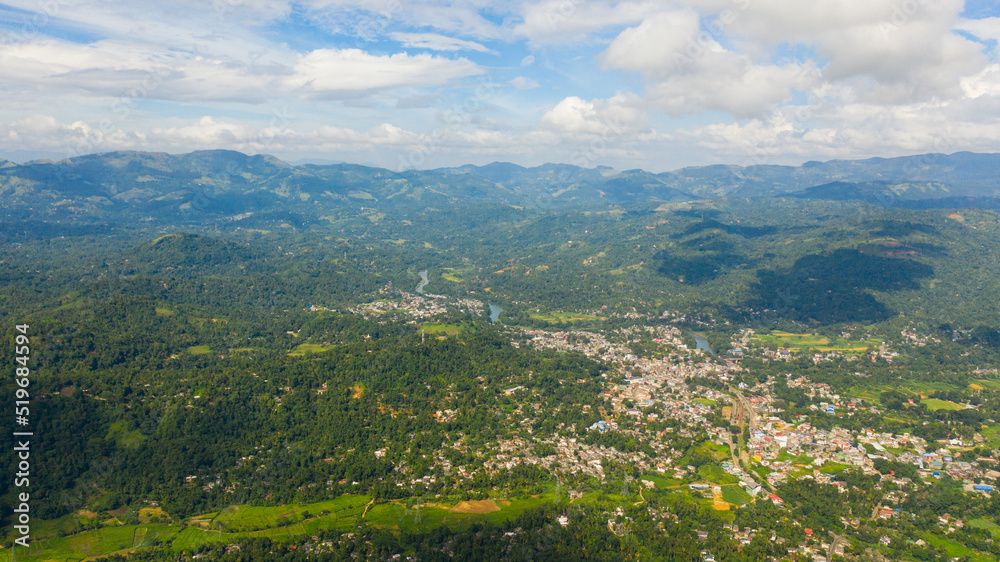 Aerial view of mountain valley with a town and agricultural lands. Gampola Town, Sri Lanka.