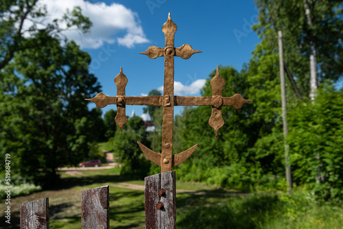 The cross at the gate of the Brodaiza Catholic church, Latvia. photo