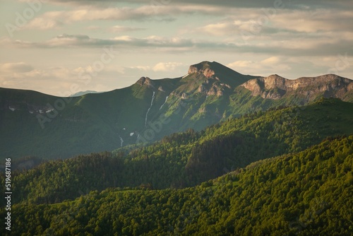 Fototapeta Naklejka Na Ścianę i Meble -  Mountain forest landscape. A mountain slope. Forest in mountains. Mountain green hills landscape.