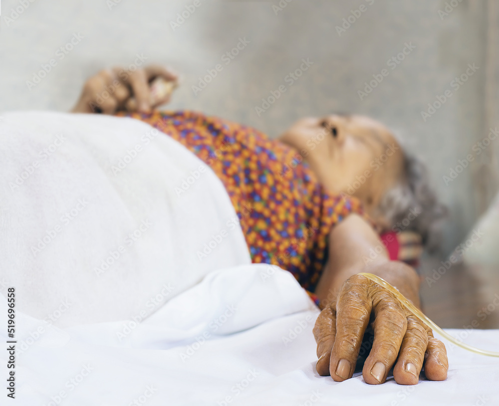 Hand old people patient in the hospital with saline intravenous Hand old people patient in the hospital with saline intravenous