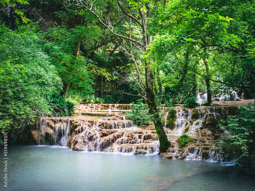 Waterfall cascade in the forest called Kroshuna waterfalls in Bulgaria.