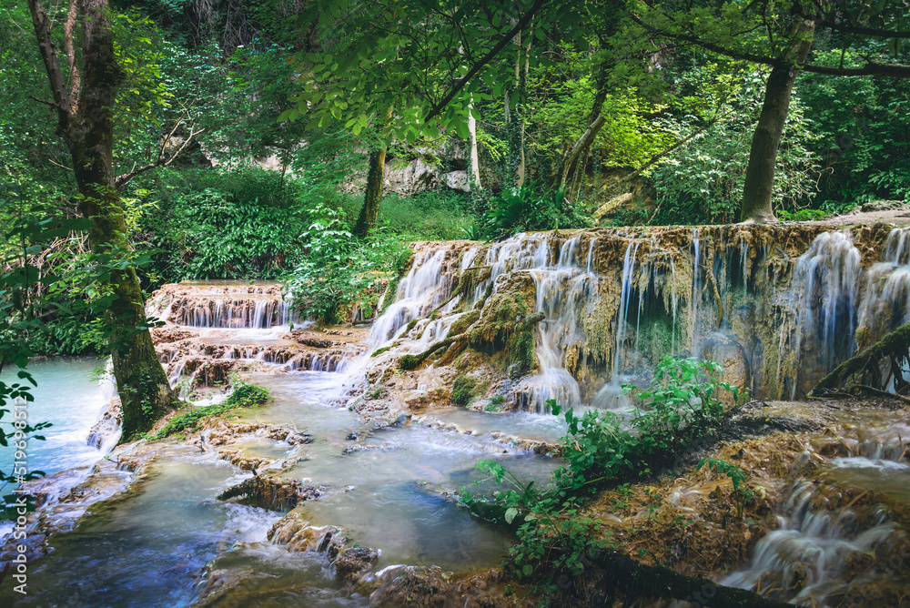 Waterfall cascade in the forest called Kroshuna waterfalls in Bulgaria.