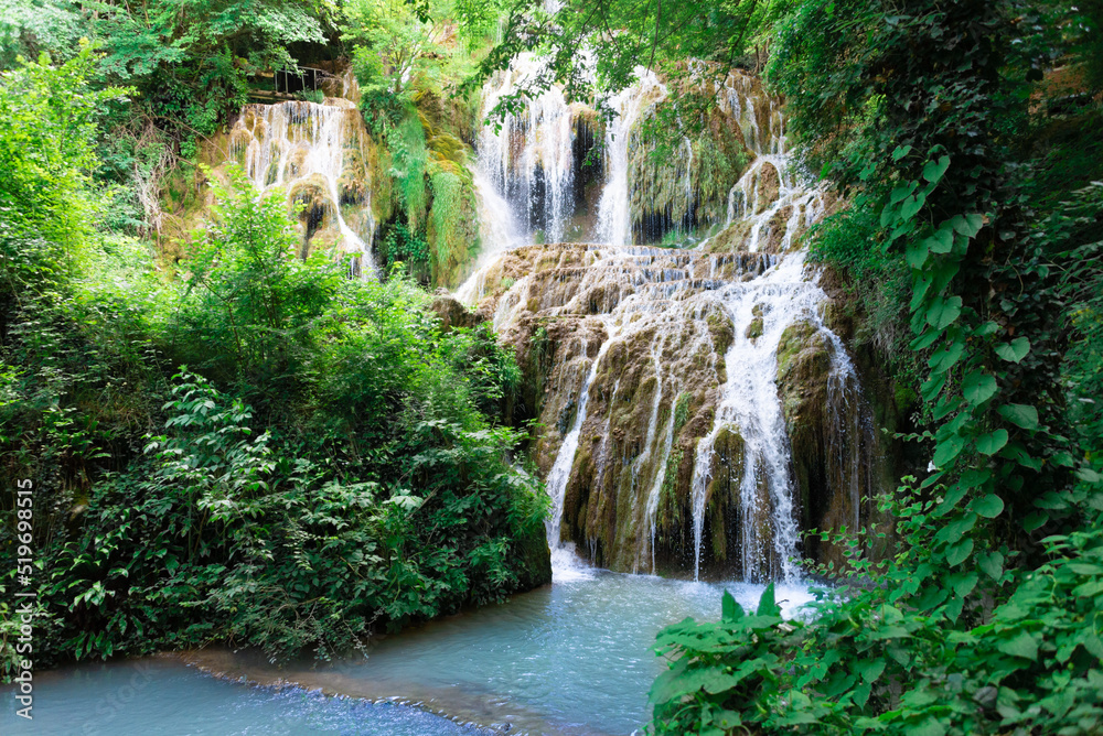 Waterfall cascade in the forest called Kroshuna waterfalls in Bulgaria.