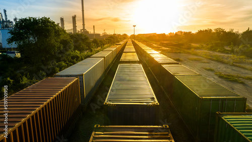 Fototapeta Naklejka Na Ścianę i Meble -  Freight train with Containers Cargos at sunset sky back ground, Freight service forwarding and Logistics transportation Industry concept