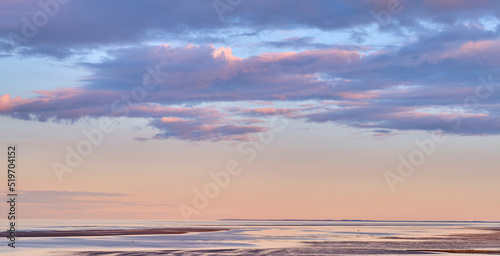 Copy space, sea and ocean view with sunset sky and stratocumulus clouds over calm, serene or peaceful beach. Relaxing, tropical and remote seascape with copyspace on private coastal island at sunrise photo