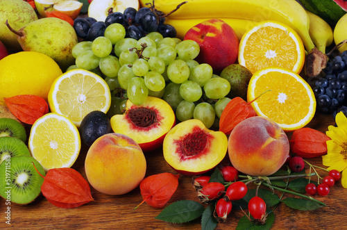 Fototapeta Naklejka Na Ścianę i Meble -  
A variety of fresh ripe fruits on a wooden table.
