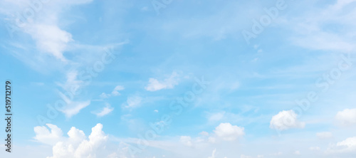 Blue sky background with tiny clouds.
