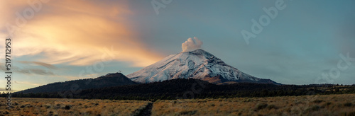 Crater fumarole among clouds of popocatepetl volcano in Mexico, panoramic view photo
