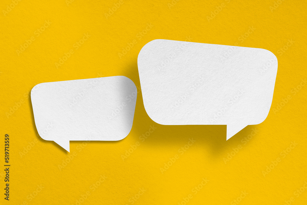 speech balloon shape white paper isolated on yellow background speech balloon shape white paper isolated on yellow background
