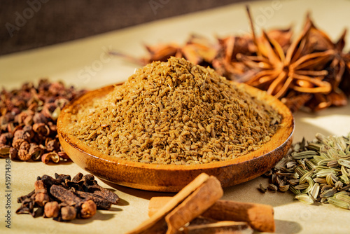 Fototapeta Naklejka Na Ścianę i Meble -  Chinese traditional seasoning five spice powder and raw materials on retro background
