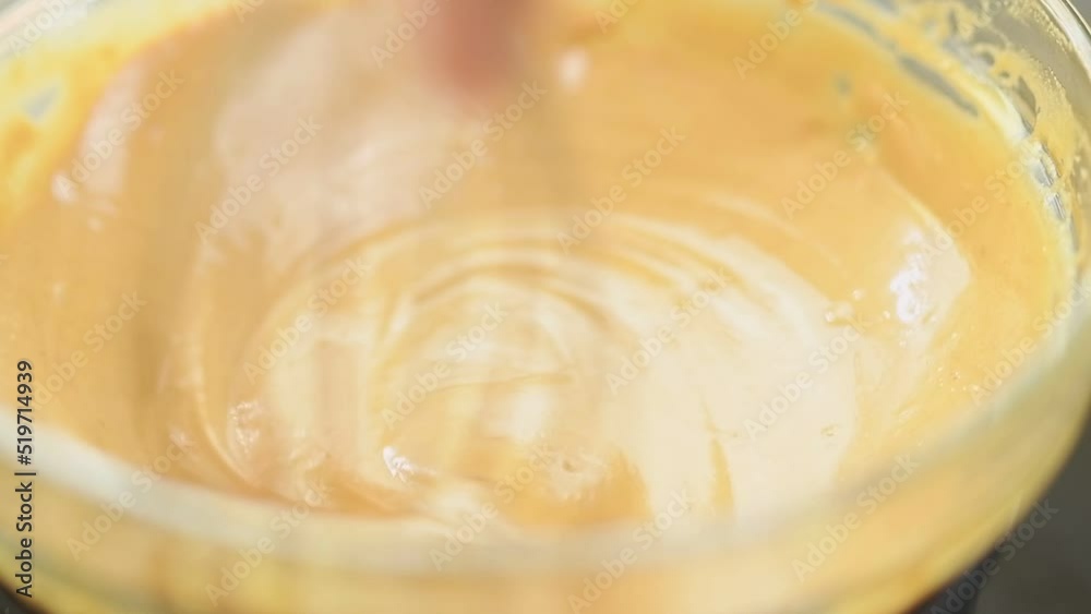 Preparing delicious cream to make cake.
Preparing delicious cream to make cake.