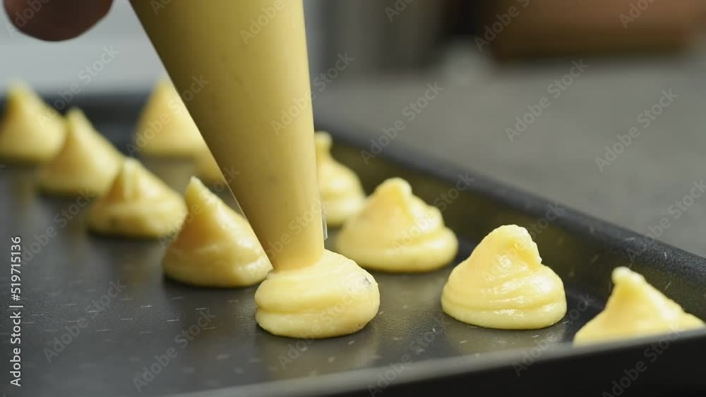 The chef preparing parmesan Gougeres.
The chef preparing parmesan Gougeres.