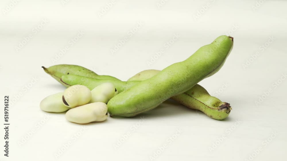 Fresh broad beans on a solid color background Fresh broad beans on a solid color background