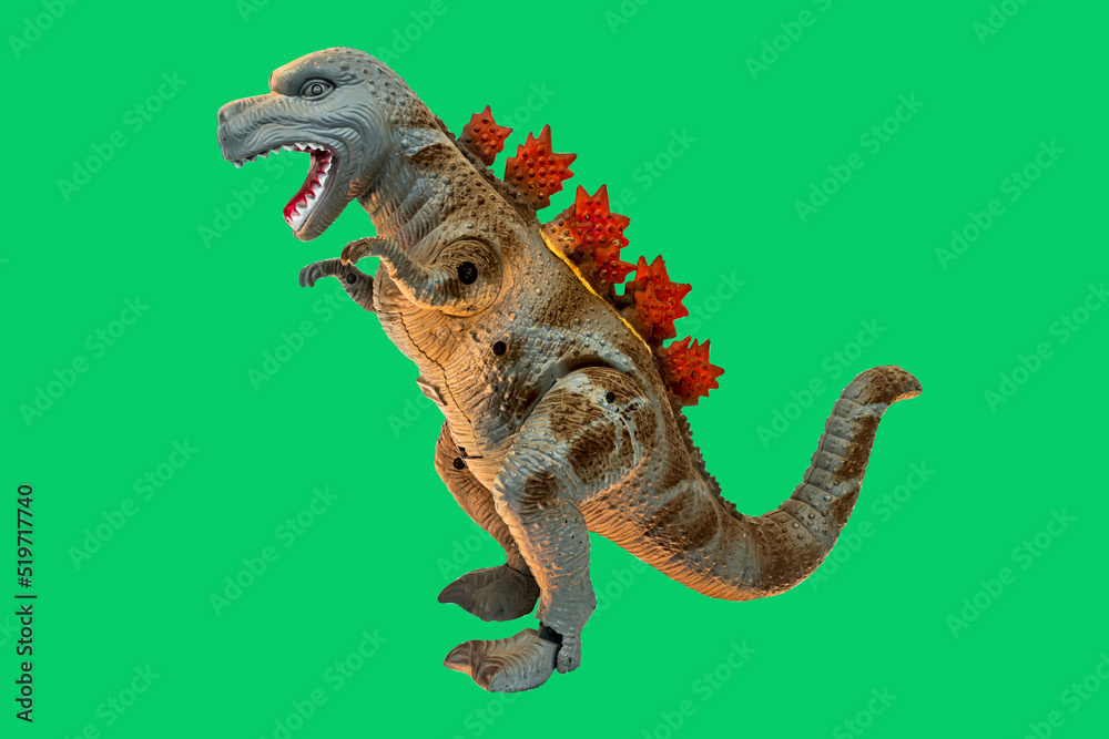 Dinosaur toy on green screen background. Take a photo and cut the ...