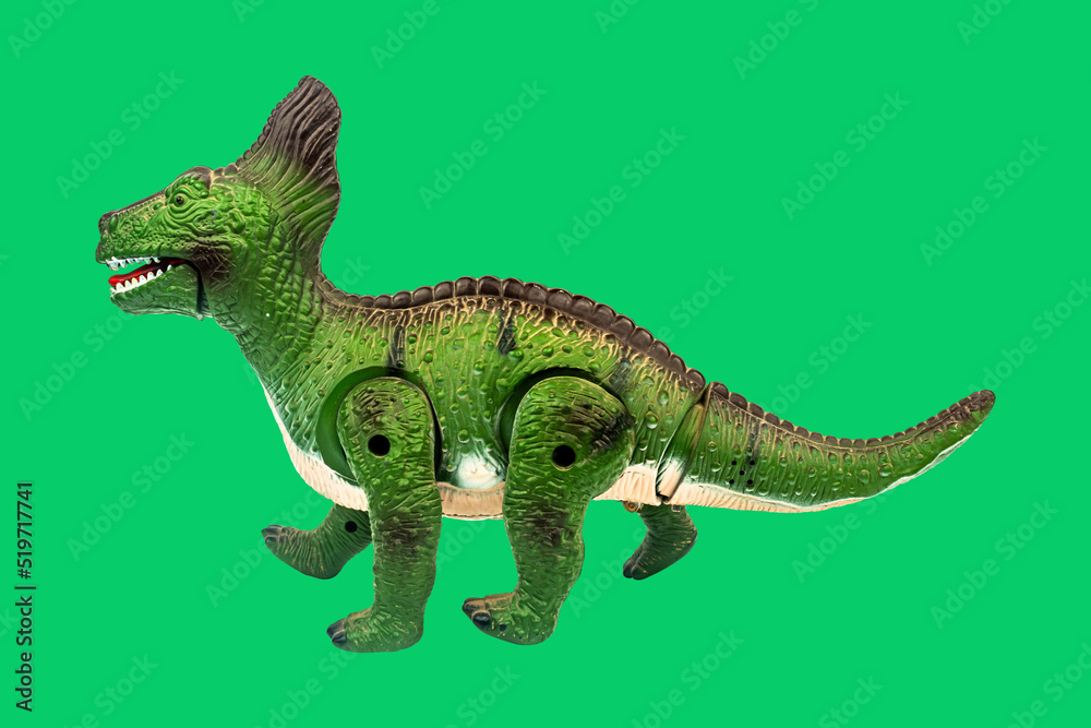 Dinosaur toy on green screen background. Take a photo and cut the ...
