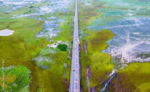 Aerial view of Chalerm Phra Kiat road or Ekachai Bridge cross the lake at Phatthalung, Thailand photo