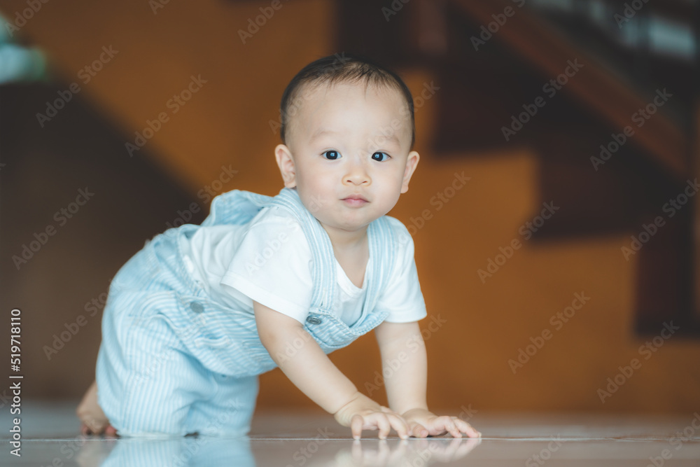 Cute little toddler trying and learning to crawl at home Cute little toddler trying and learning to crawl at home